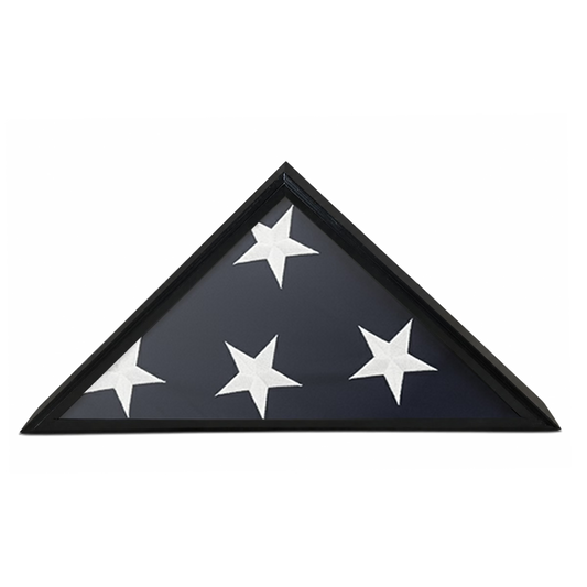 A triangular flag display case with a wooden frame on a white background featuring. The flag is folded showing four white stars and the blue canton