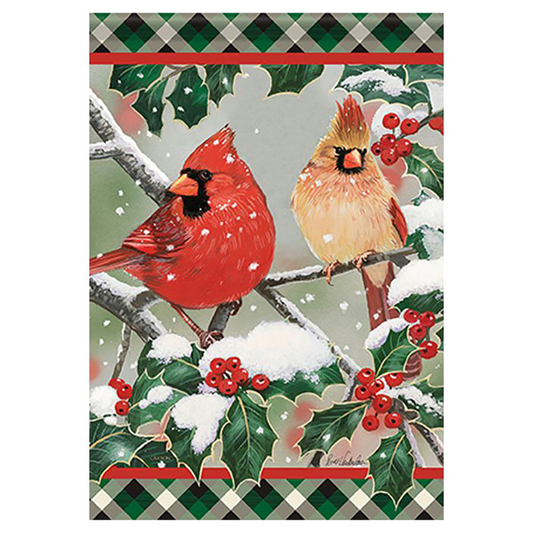 Decorative flag with two cardinals on a branch surrounded by holly leaves and berries.