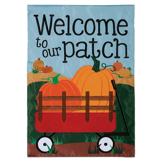 Decorative garden flag with pumpkins and a wagon, featuring the text 'Welcome to our patch'.
