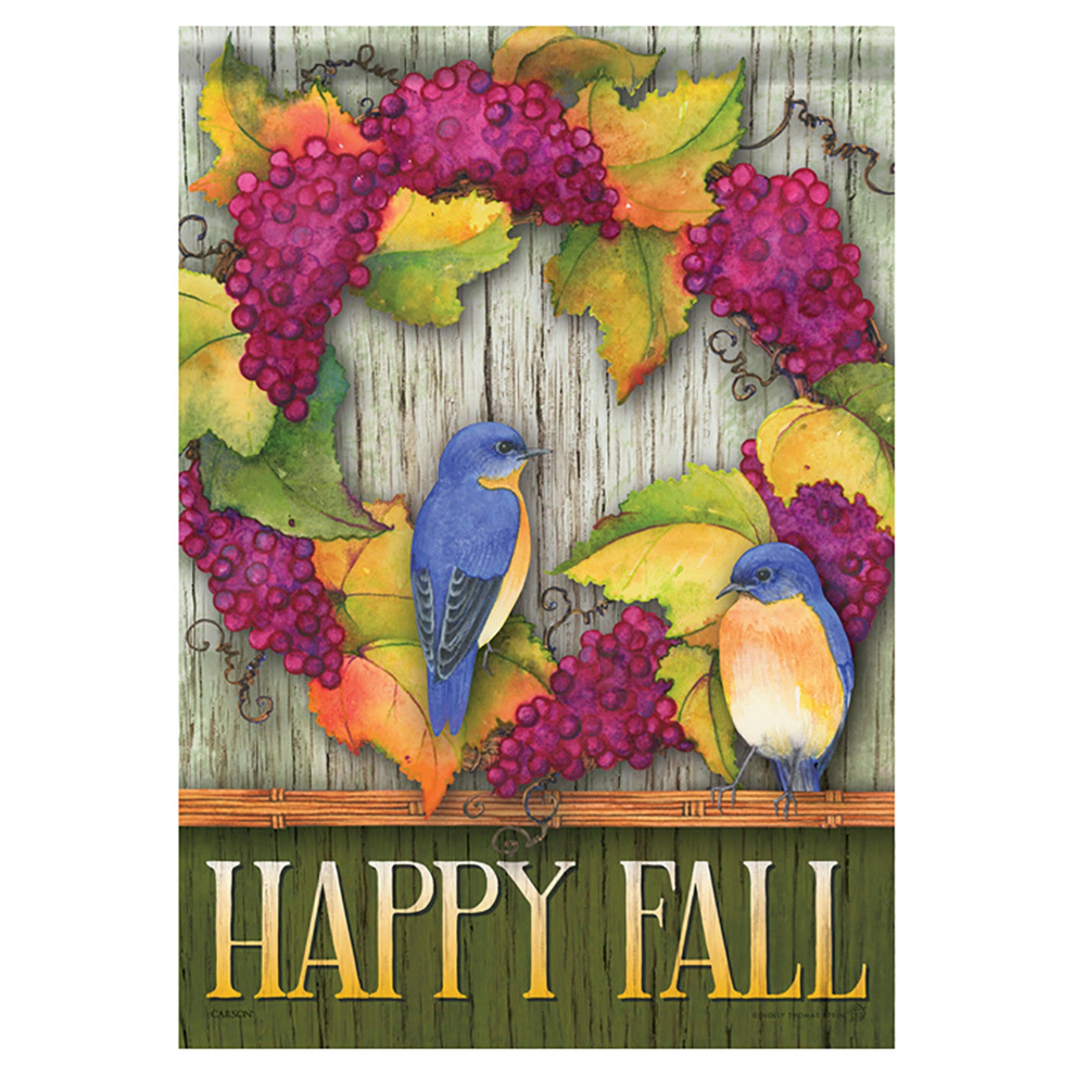 Decorative flag with bluebirds, grapes, and 'Happy Fall' text on a wooden background.