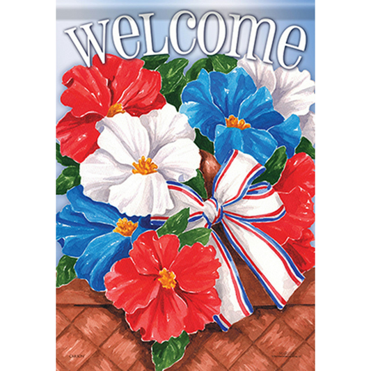 Decorative flag with red, white, and blue flowers and a bow on a wooden surface.