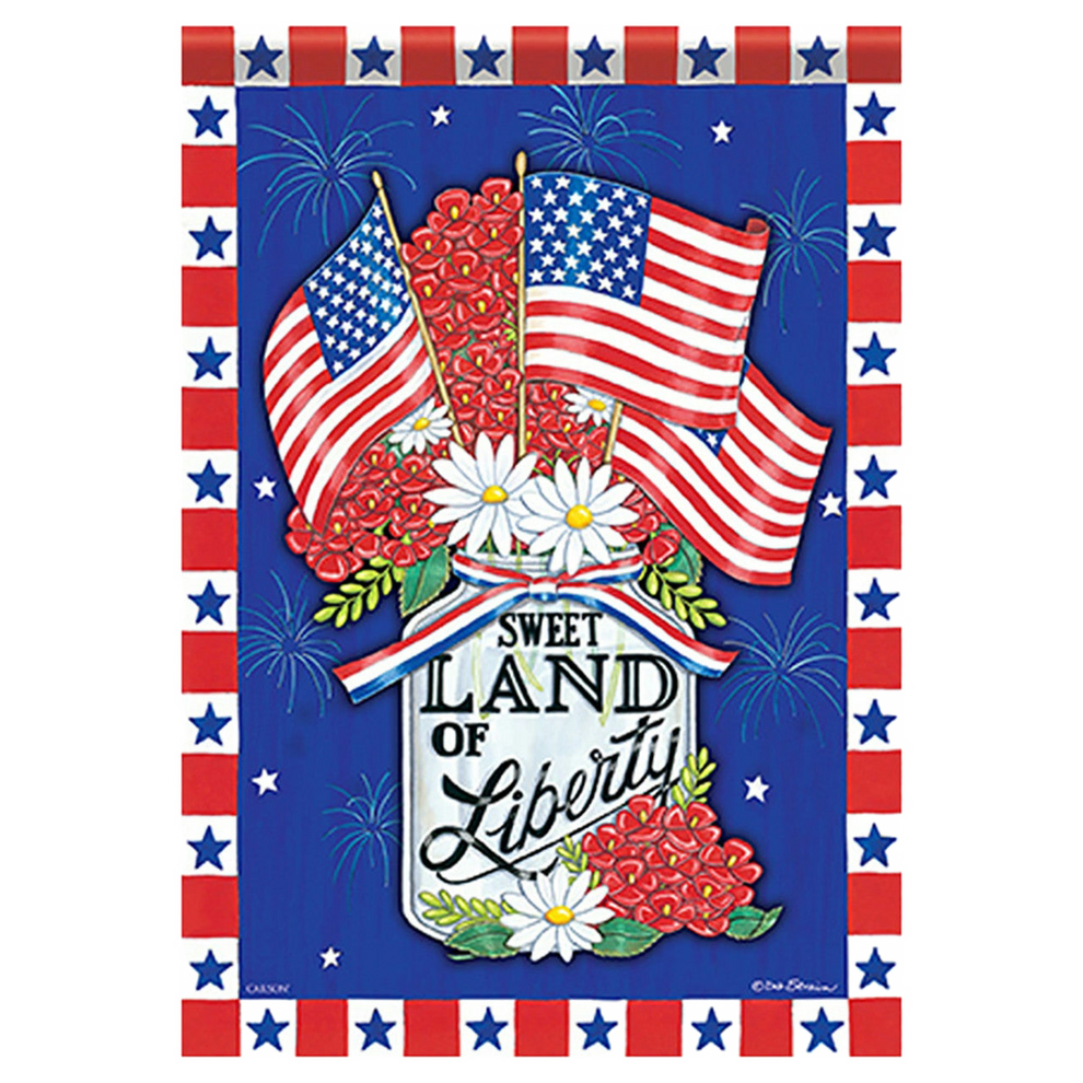 Decorative flag with American flags, flowers, and 'Sweet Land of Liberty' text on a blue background.