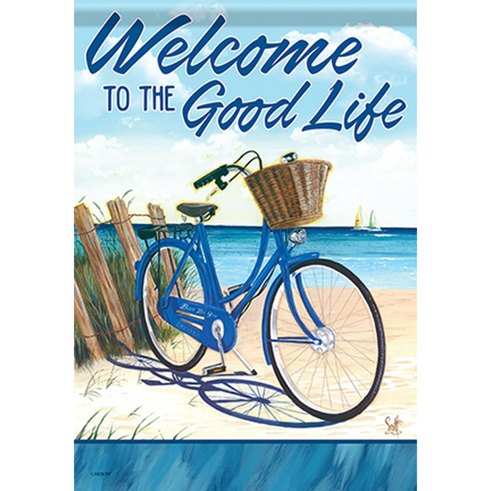 Decorative flag with a blue bicycle with a basket on a beach, text 'Welcome to the Good Life' above.