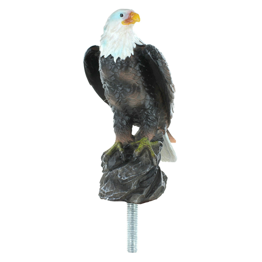 Eagle figurine on a rock with a white background