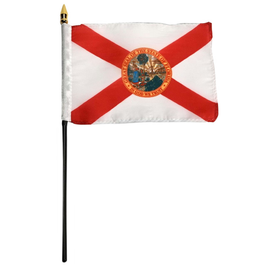 State of Florida stick flag featuring the classic red diagonal cross on a white background with the full-color Florida state seal in the center. The words 'GREAT SEAL OF THE STATE OF FLORIDA' and 'IN GOD WE TRUST' are written on the edges of the seal.