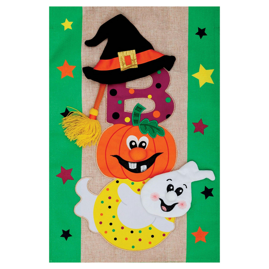 Decorative Halloween-themed garden banner with a pumpkin, ghost, and witch hat on a green background.