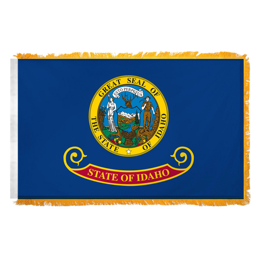 State of Idaho flag featuring the full-color state seal with the text 'ESTO PERPETUA' on a blue background with the 'State of Idaho' red and gold banner. This flag features yellow fringe on the edges.
