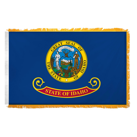 State of Idaho flag featuring the full-color state seal with the text 'ESTO PERPETUA' on a blue background with the 'State of Idaho' red and gold banner. Flag features yellow fringe.