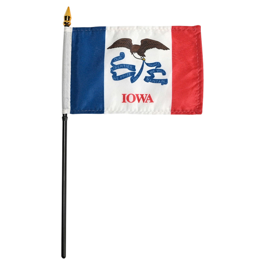 State of Iowa stick flag featuring three vertical stripes of blue, white, and red, with the center white stripe being wider than the outer two. In the center white field, a bald eagle flies carrying a long, waving blue streamer in its beak that reads 'OUR LIBERTIES WE PRIZE AND OUR RIGHTS WE WILL MAINTAIN'. Directly below the streamer, the word 'IOWA' is printed in large, red all-caps letters.