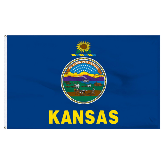 State of Kansas blue flag with Kansas state seal in the center, depicting a landscape with a rising sun, a steamship, a settler plowing a field, a covered wagon train, and Native Americans hunting buffalo. Above the scenery is the Latin motto 'AD ASTRA PER ASPERA'. Above the seal sits a gold and blue sunflower twist, and the word 'KANSAS' is printed in large, gold all-caps letters directly below the seal.