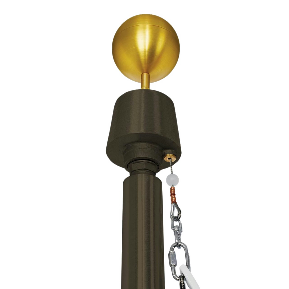 Commercial grade flagpole with a gold-colored ball on top, equipped with a wire cable system.