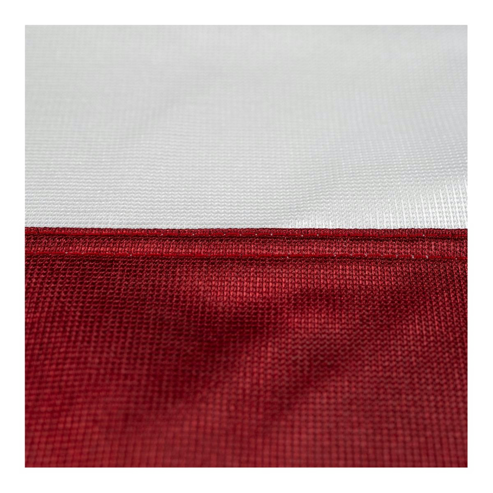 Close up of a Texas state flag featuring the white and red