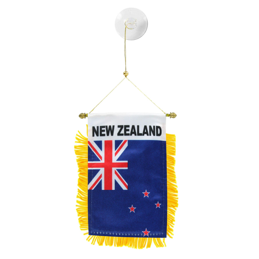 Hanging New Zealand flag with yellow fringe on a white background