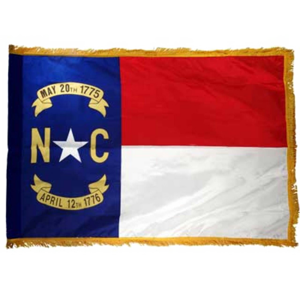 North Carolina state flag with blue, red, and white sections featuring text and symbols