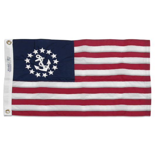 U.S. Yacht Ensign flag with a white anchor and 13 stars in the blue canton, plus red and white stripes.