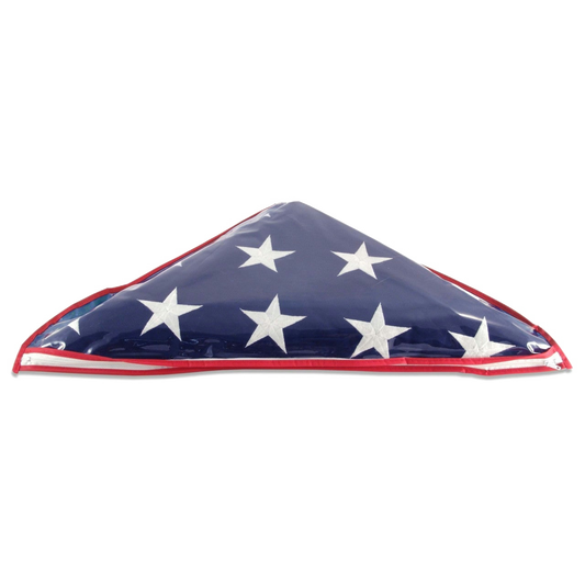 An American flag packaged and folded in a triangle with a blue field, white stars, and red border, photographed on a plain white background.