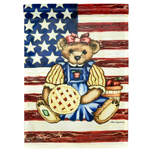 A garden banner flag with a patriotic teddy bear and an American backdrop