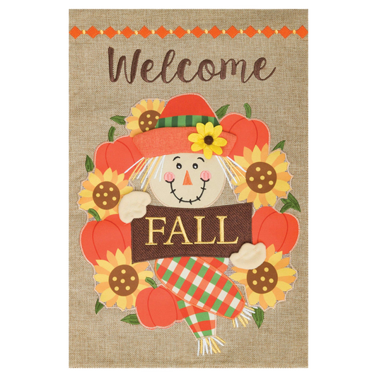 Decorative fall-themed garden flag with a scarecrow, pumpkins, and sunflowers on a burlap background.