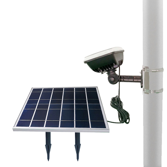 Solar panel with attached light fixture on a white background