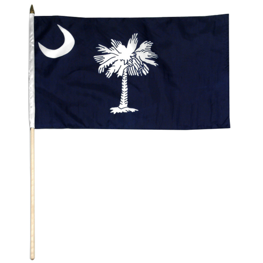 South Carolina navy blue flag with white palmetto tree and moon on a wooden stick against a white background