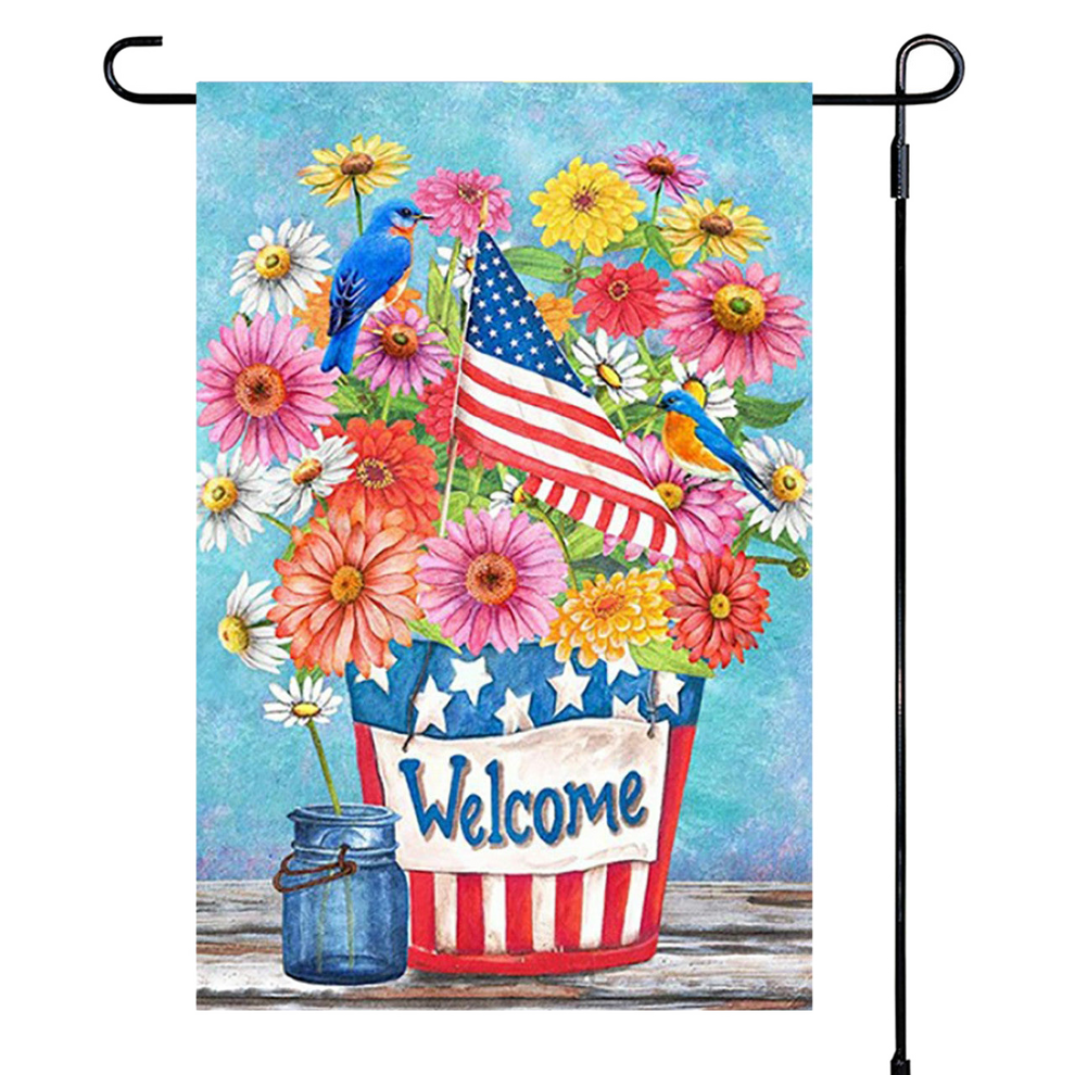 Decorative garden flag with flowers, birds, and an American flag on a blue background.