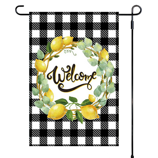 Garden flag with lemon wreath and 'Welcome' text on a black and white checkered background
