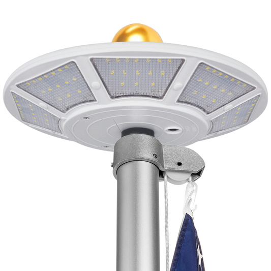 Solar flagpole LED light with gold top on a white background