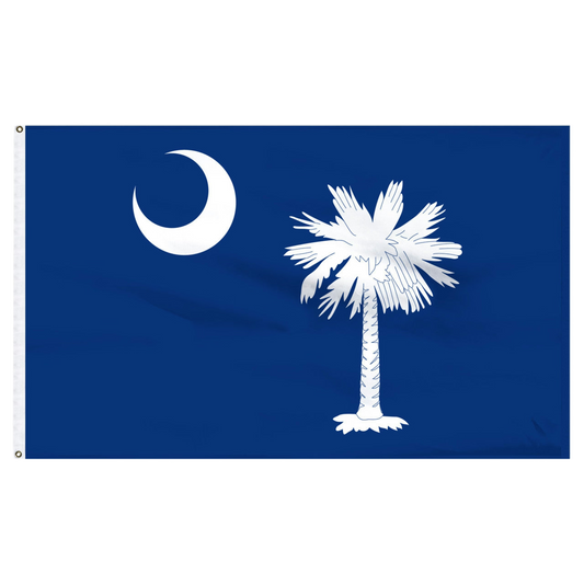 South Carolia state flag with a white palm tree and moon on a blue background