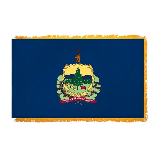 Vermont state flag featuring the full-color state coat of arms and 'Vermont, Freedom and Unity' motto on a solid azure blue field. This flag has fringe on the edges.