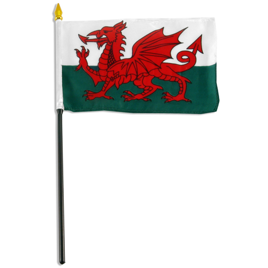 Welsh stick flag with a red dragon design on a white and green background