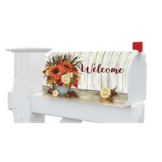 White mailbox with a decorative cover featuring autumn flowers and the word 'Welcome'.