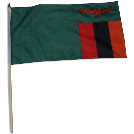 Zambia flag with green field, orange eagle, and red, black, and orange vertical stripes on a stick.