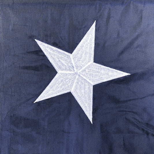 Super Tough 8ft x 12ft Sewn Nylon American Flag - Secondary Image - United States Flag Store Close up of an embroidered star on the blue canton of an American flag