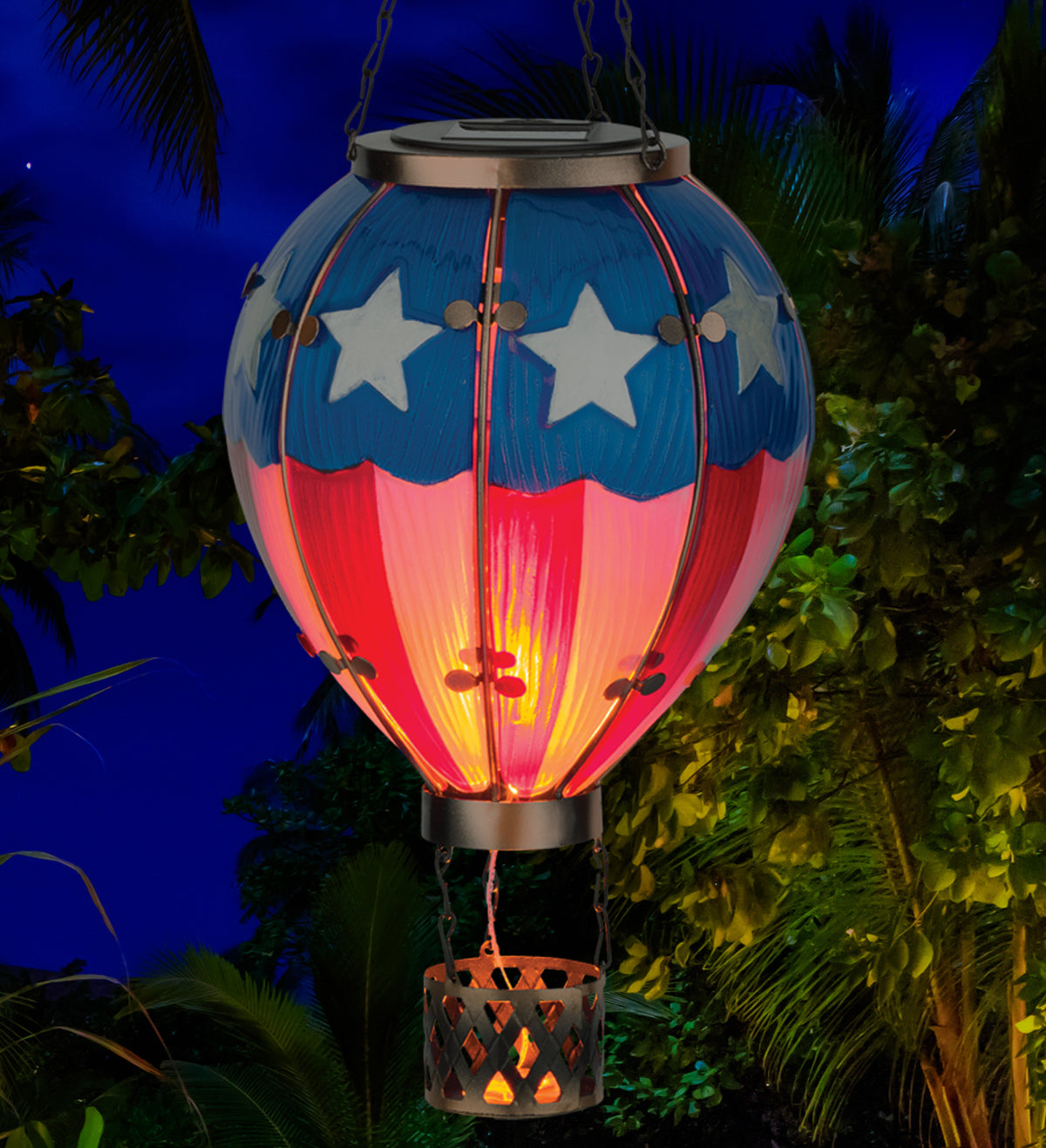 Solar-powered hot air balloon lantern with American flag design, glowing in the dark.
