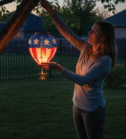 Woman holding a colorful lantern in a backyard at dusk