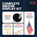 Indoor flag kit details: water or sand-fillable gold base, oak wood pole with brass joints, and multiple decorative topper options.