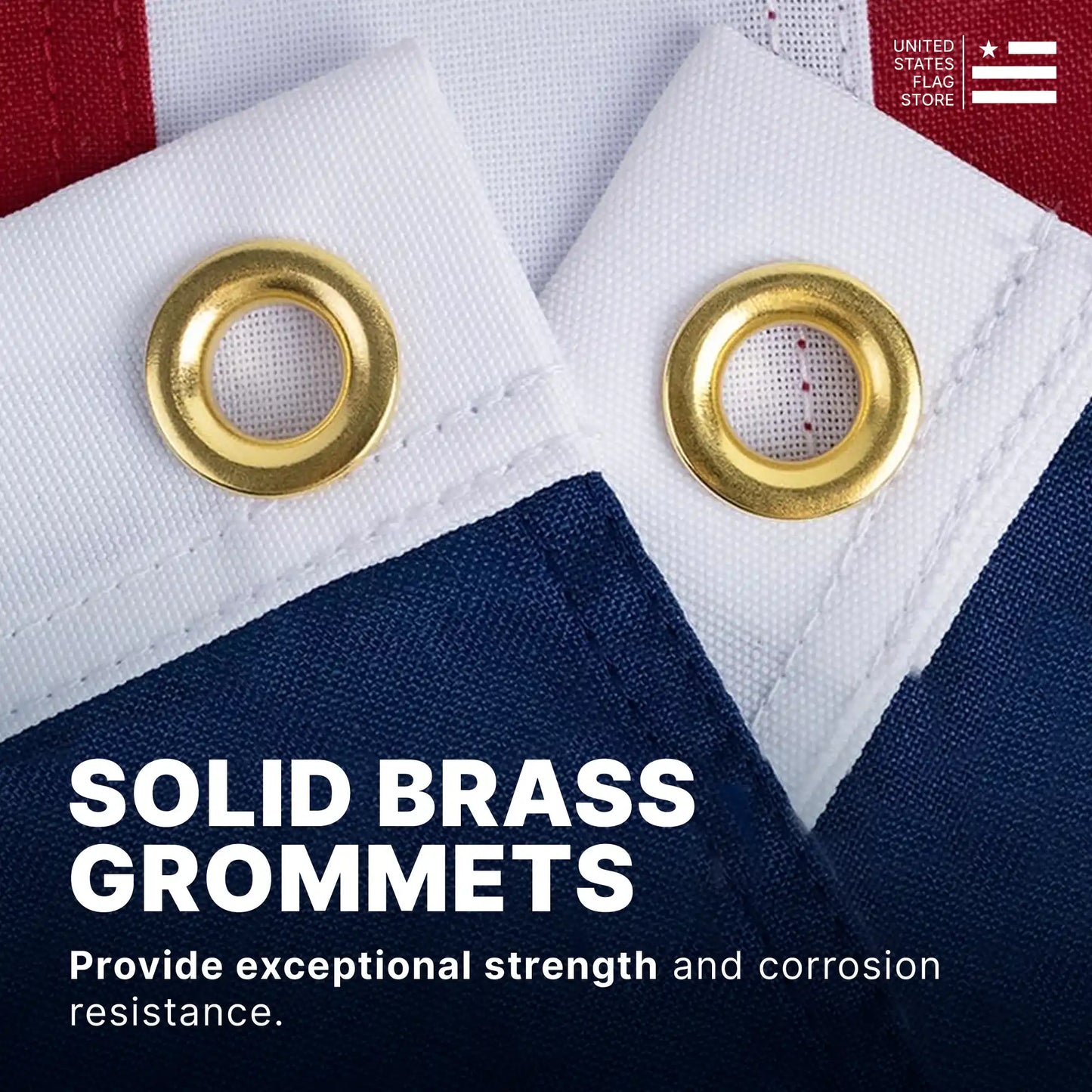 Two solid brass grommets on a white flag header providing strength and corrosion resistance for outdoor hanging.