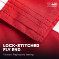 Macro view of a lock-stitched fly end on an American flag, designed to resist fraying and tearing in high winds.