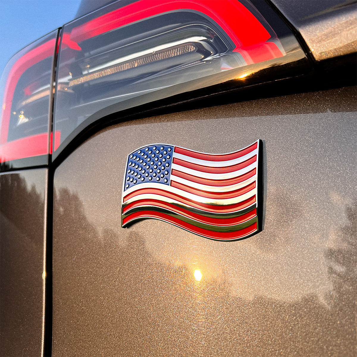 The Wavy American Flag Badge - 3.8" x 2.5" All-Weather Emblem - Red, Blue & Chrome Finish