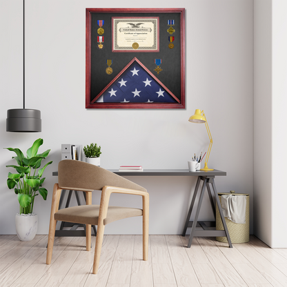 Framed American flag and certificate on a wall above a desk with a chair.