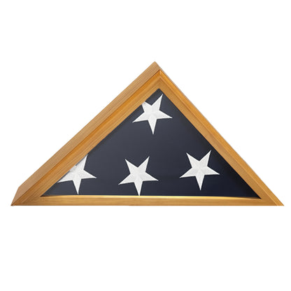 A triangular flag display case with a wooden frame on a white background featuring.  The flag is folded showing four white stars and the blue canton