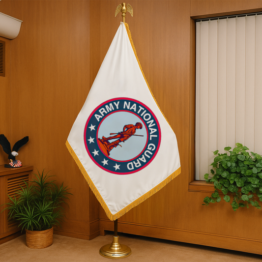 Army National Guard flag on a stand against a wooden wall with plants.