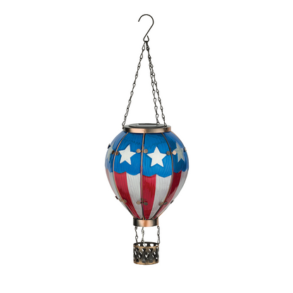 A decorative lantern shaped like a hot air ballon with an American Flag design