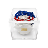 Rose bouquet with American flag design in a clear box on a white background