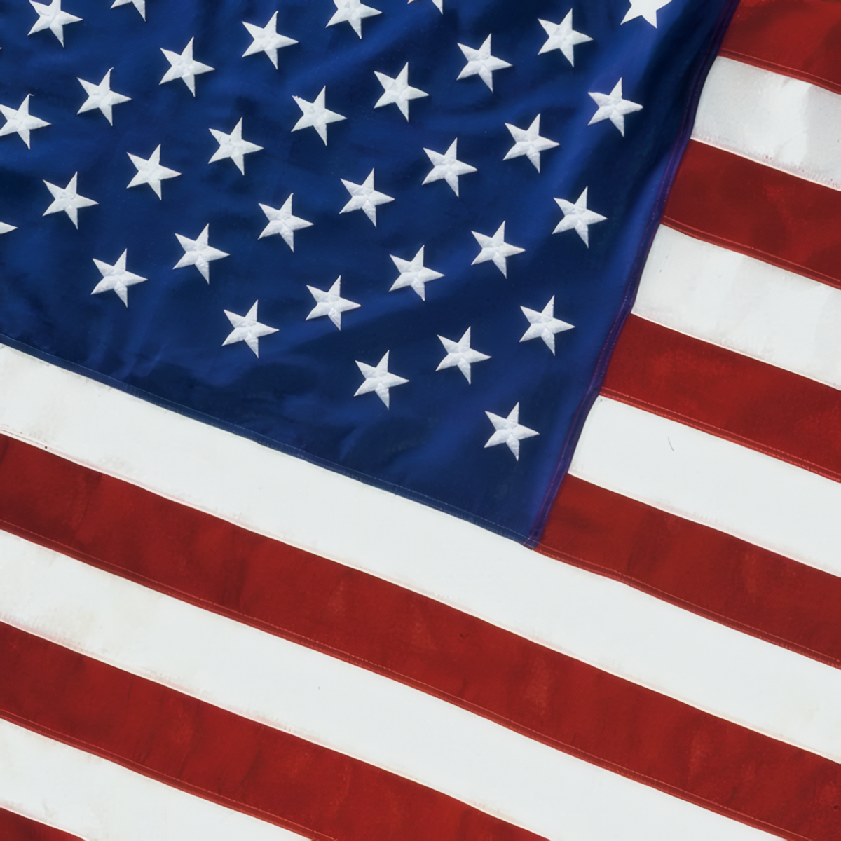 Close-up of an American flag with stars and stripes.