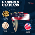 Handheld USA flags with gold ball tip, premium quality sticks, and vivid color on a dark blue background.