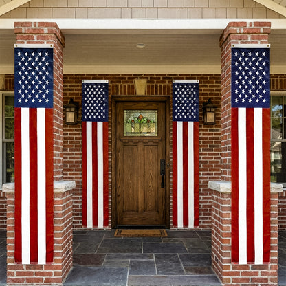 Front door of a house with American flags on either side