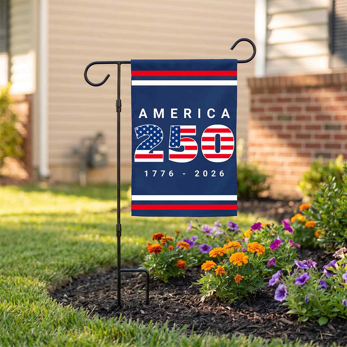 Black metal garden flag stand holding an America 250 flag.
