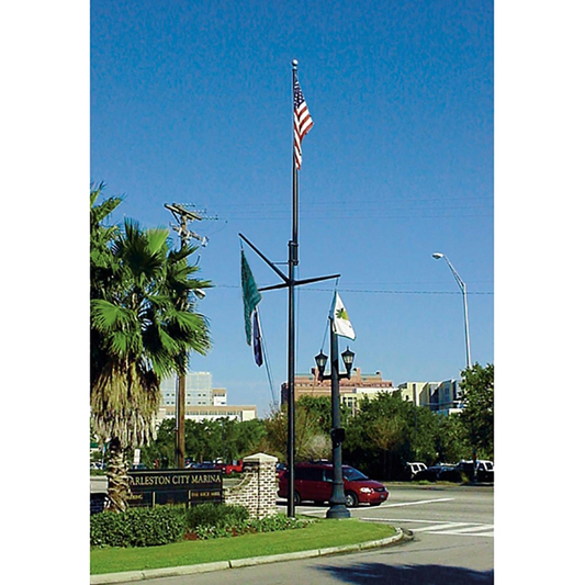 An American flag on a flagpole with nautical mast and flags