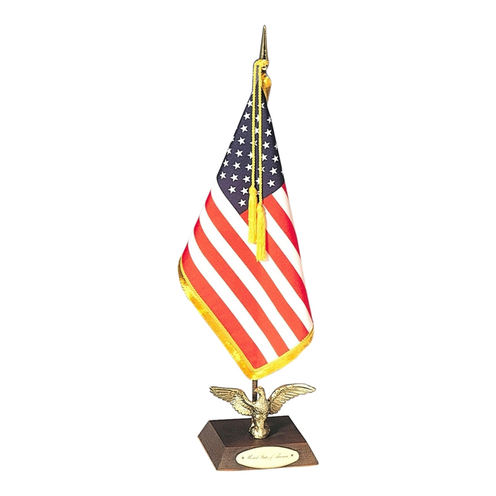 American flag on a wooden base with an eagle design on a white background
